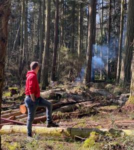 Contributed photo|Fire Marshall RJ Myers observes CCC conservation burn on Squaw Bay Road, Shaw Island.
