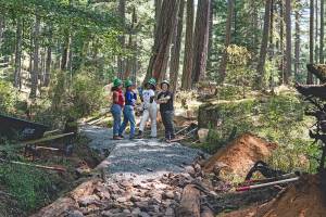 Washington Trail Association workers pose on a trail they are refurbishing in Moran State Park. (Contributed photo)