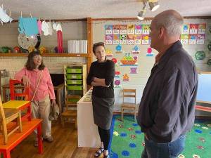 Janice Otto, Victoria Compton and Rep. Rick Larsen talk at Alphabet Soup on July 14.