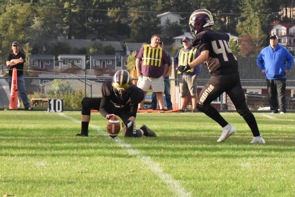 Wolverine Victor Velasquez, #44, kicks for the extra point after a Wolverine touchdown. (John Stimpson photo)
