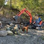 Contributed photos
Top: Salmon Point community members, Mark Pearson, Rosemary Saylor, San Olson and Tina Whitman celebrate the projects completion. Bottom:Armor removal day one.