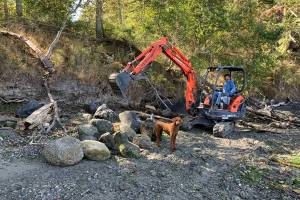 Contributed photos
Top: Salmon Point community members, Mark Pearson, Rosemary Saylor, San Olson and Tina Whitman celebrate the projects completion. Bottom:Armor removal day one.