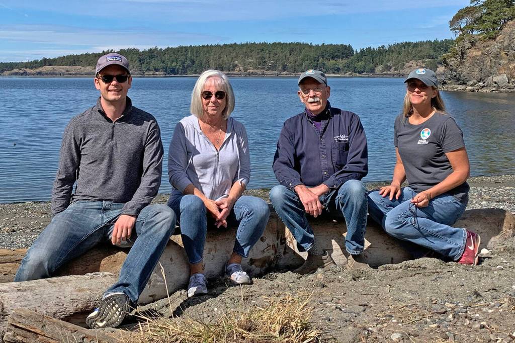 Salmon Point community members, Mark Pearson, Rosemary Saylor, San Olson and Tina Whitman celebrate the projects completion. (Contributed photo)