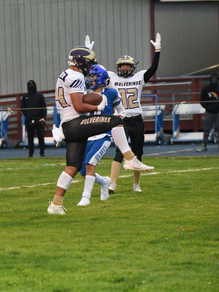 Wolverine Chris Gustafson, #24, finishes his drive with a touchdown. (John Stimpson photo)