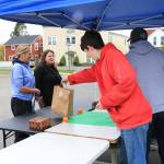 Sienna Boucher/staff photo
<em>Ethan Amaro handing out a gift bag. </em>