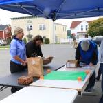 Sienna Boucher/staff photo
<em>Ray Jackson throws his arms up in excitement as Christy Putney wins a golden ticket. </em>