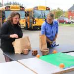 Sienna Boucher/staff photo
<em>Murien Clark and Christy Putney with their new gift bags. </em>