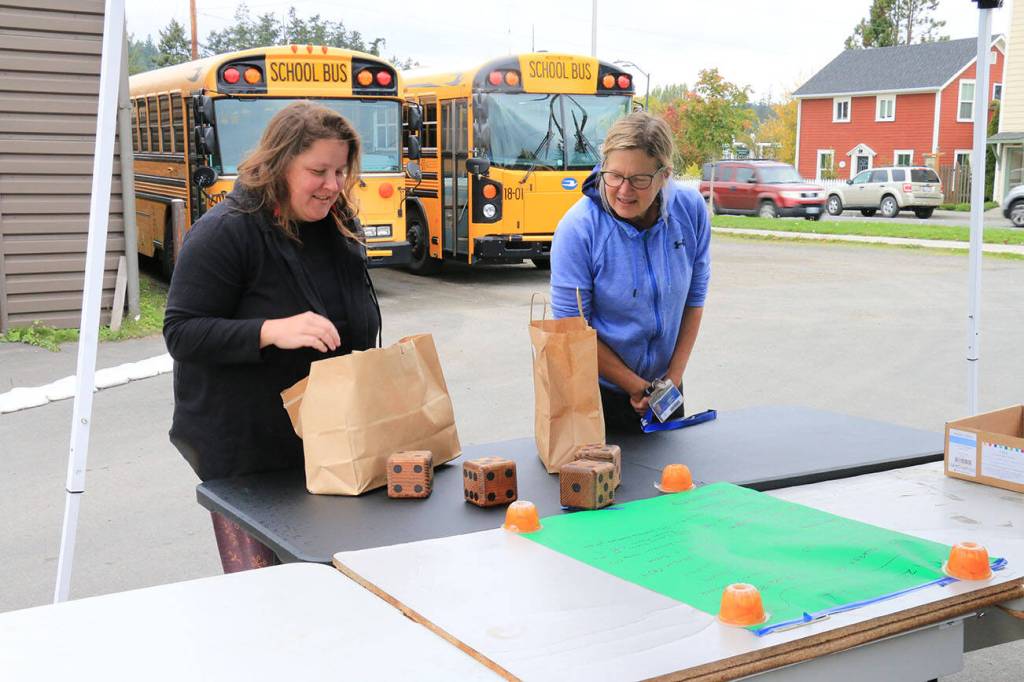 Sienna Boucher/staff photo
<em>Murien Clark and Christy Putney with their new gift bags. </em>