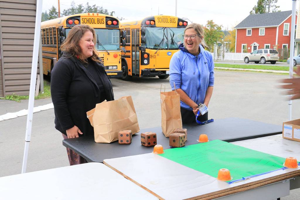 Sienna Boucher/staff photo
<em>Murien Clark rolls the dice to win a prize. </em>