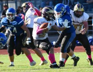 Wolverine Whiley McCutcheon, #34, runs for a good yardage gain. (John Stimpson photo)