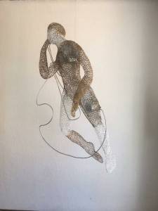 Francie Allens work consists of sculpted of wire and lacey metal netting.