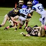 John Stimpson
Wolverine Dylan Roberson #7 tackles a Braves runner.