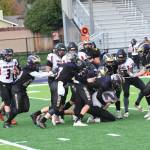 John Stimpson photo
Dylan Roberson #7 and friends bring down Toledo runner