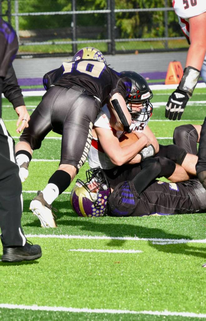 John Stimpson photo
Pierce Kleine #30 and Nathan Posenjak#10 tackle Toledo runner.