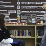 Staff photo/ Sienna Boucher
Isabella VanderYacht presents while Rian McElrath and Sterling Mustain watch.