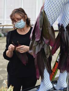Patricia Guthrie/Contributed photo
Kara Natalia Navradszky of San Juan Islands Apotheca Design working on her mannequin before the garden show opened.