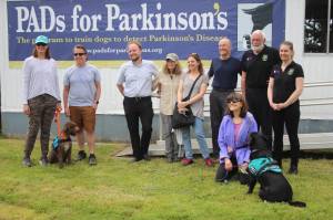 Heather Spaulding / Staff photo
From left to right: Allison Moalli and John Moalli with PADs dog, Bendy, Peter Ledochowitsch, Lisa Holt Jennifer Holland, Skip Lutz, Dominique Grandjean, Capucine Gallet, and Katy Barsamian with PADs dog, Ella in the front row