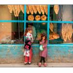 Girls in front of bakery. Photo by James Longley.