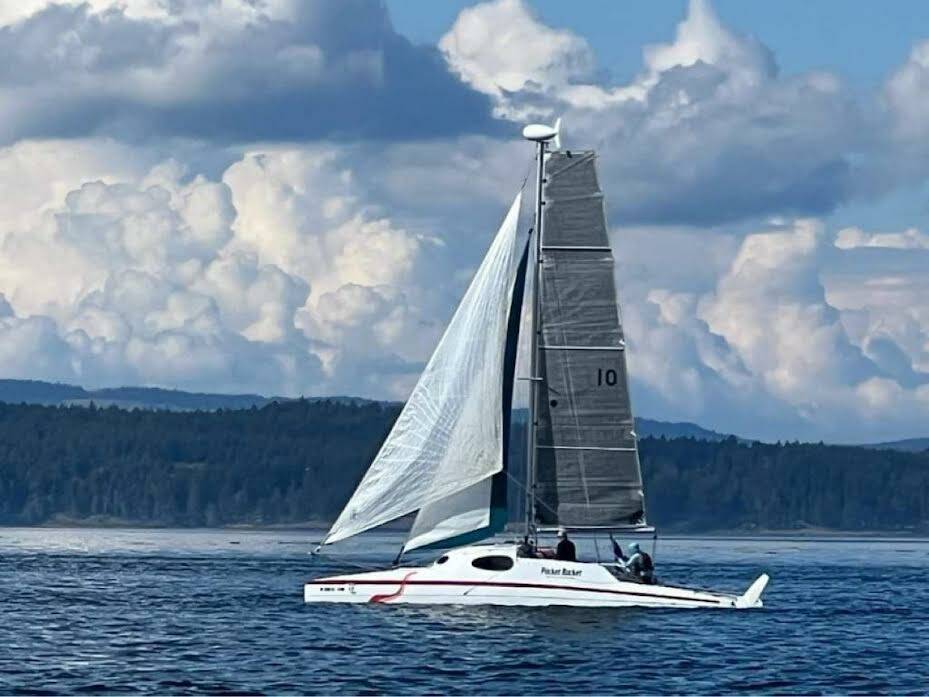 Team Pocket Rockanaut aboard their Gougeon 32' Catamaran under sail off Stuart Island during the 2022 R2AK Race To Alaska.