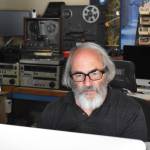 Kelley Balcomb-Bartok/Staff Photo
Technowizard Steven K Roberts at his desk processing digital files recently scanned into the computer.