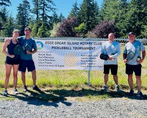 Contributed photo
Lia and Gib Black of San Juan Island, gold winners of the mixed doubles (A division) with silver winners Maggie Kulyk and Kevin Lee of Orcas Island.