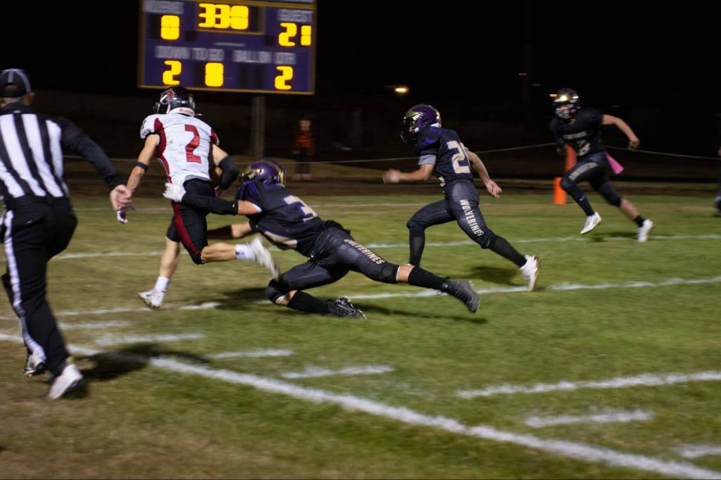 Contributed photo by Kathryn Wheeler
The defense rushes to tackle a touchdown run