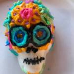 Heather Spaulding/Staff photo
A decorated sugar skull cookie and Dia de los Muertos dancers.