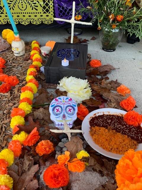 Heather Spaulding \ Staff photo
Food offerings, skulls and Marigolds.