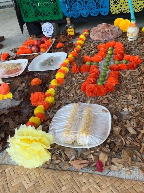 Heather Spaulding \ Staff photo
Marigolds with corn left as an offering.
