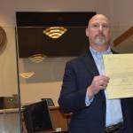Kelley Balcomb-Bartok Staff photo
Newly Elected Sheriff Eric Peter displays his official election paperwork during a ceremony Dec. 30 at the Superior Court courtroom.