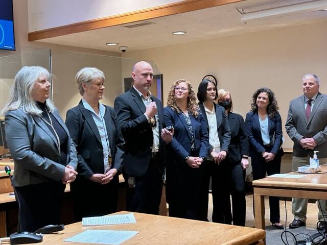 Kelley Balcomb-Bartok Staff photo
Council member Jane Fuller signs documents.
Elected officials lined up to be sworn in. Left to right: Court Clerk Lisa Henderson, Treasurer Rhonda Peterson, Sheriff Eric Peter, Auditor Natasha Warmenhoven, Prosecuting Attorney Amy Vira, Council member Jane Fuller and Assessor John Kulseth.