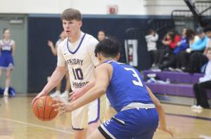 Heather Spaulding \ Staff photo
Nathan Posenjak takes the ball down court.