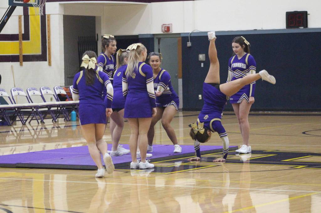 Heather Spaulding \ Staff photo
Wolverine Cheer Squad brings on the gymnastics during half-time