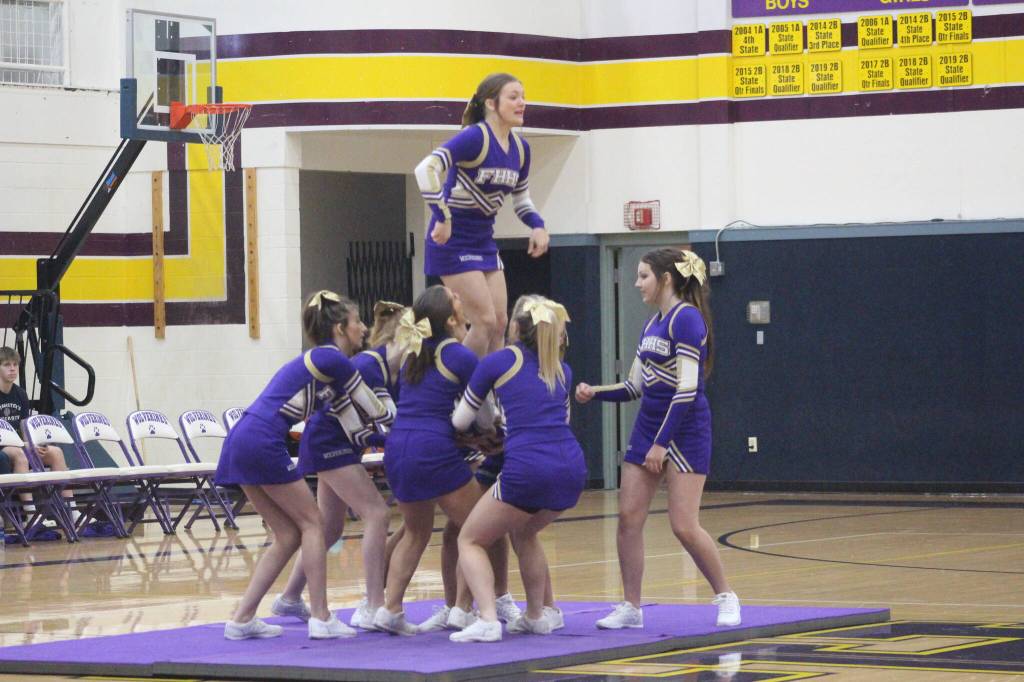 Heather Spaulding \ Staff photo
Wolverine Cheer Squad brings on the gymnastics during half-time
