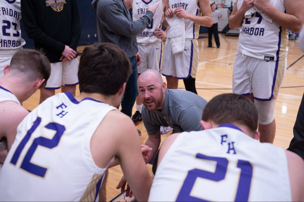 Contributed photo by Kathryn Wheeler
Coach Brandyn Pedersen strategizes with the team.