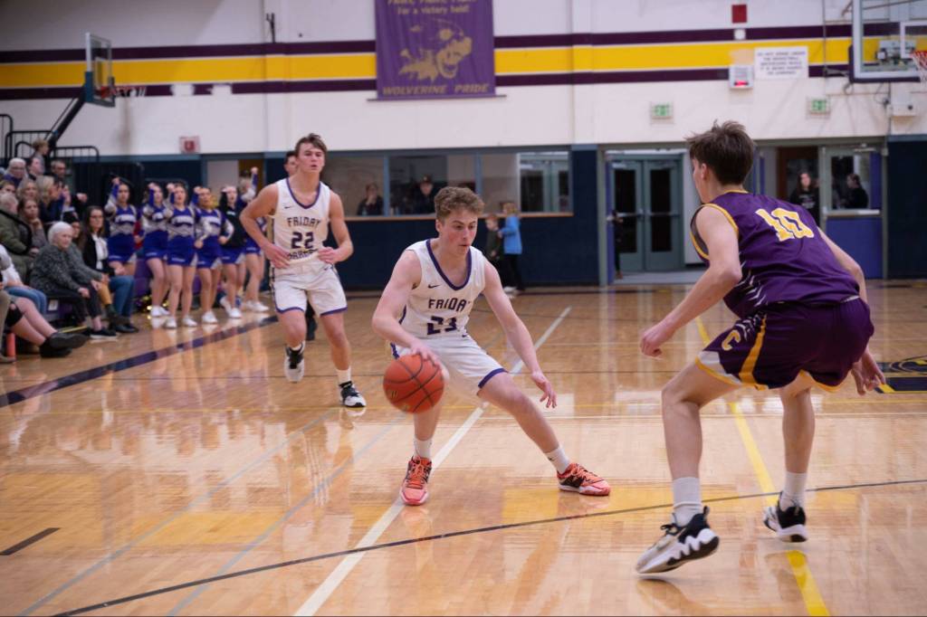Contributed photo by Kathryn Wheeler
Drake Goodrich takes the ball down court while Pierce Kleine follows.