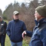 Kelley Balcomb-Bartok/Staff photo
U.S. Congressman Rick Larsen listens to local historian Michael Vouri during a recent visit to Zylstra Lake on San Juan Island.