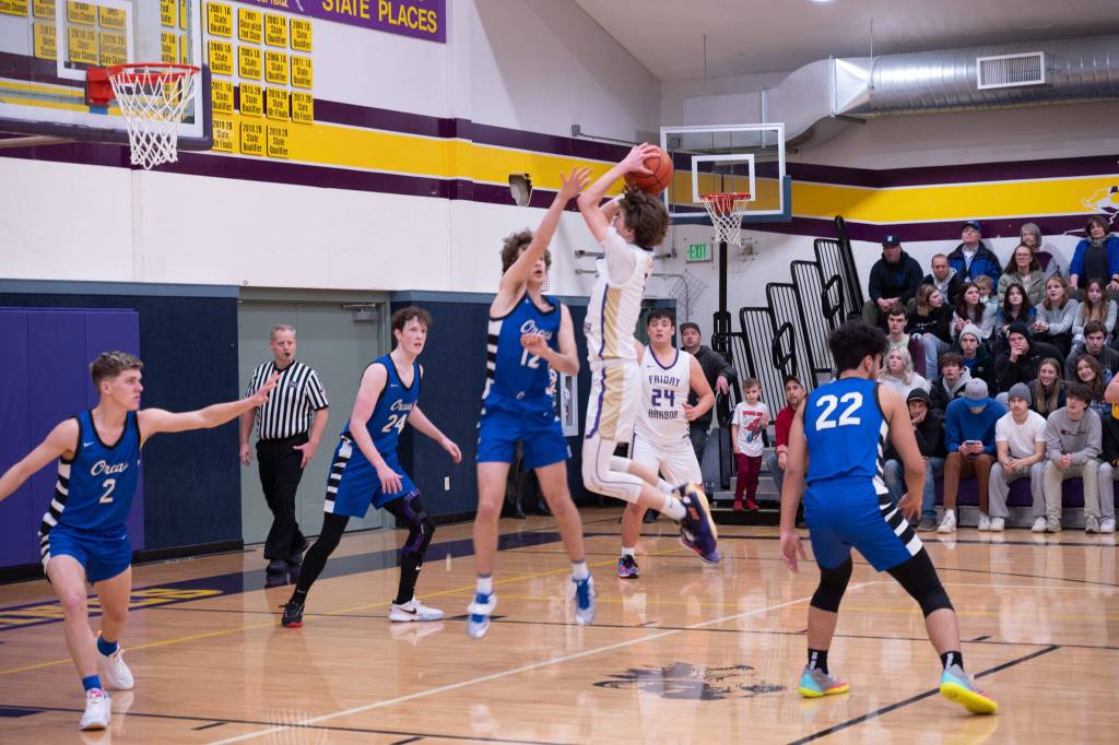 Contributed photo by Kathryn Wheeler
Jaxson Waldron makes a shot while Chris Gustafson looks on.