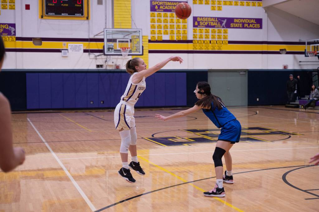 Contributed photo by Kathryn Wheeler
McKenna Clark passes the ball over the head of an Orcas Viking.