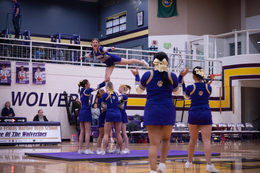 Contributed photo by Kathryn Wheeler
You are only as strong as the foundation that you stand on. The Friday Harbor High School Cheerleading Team advanced their stunting skills in their last half-time routine. In this action shot, Paige Carlton-Flierl pulls an Arabesque while being based by her powerful stunt group.