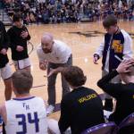 Contributed photo by Kathryn Wheeler
Coach Brandyn Pedersen huddles with the team.