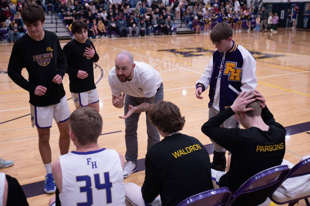 Contributed photo by Kathryn Wheeler
Coach Brandyn Pedersen huddles with the team.