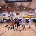 Contributed photo by Kathryn Wheeler
An airborne Pierce Kleine fights to take a shot.