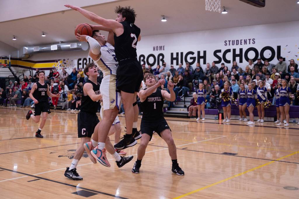 Contributed photo by Kathryn Wheeler
Wolverines fight aggressive blocking by Coupeville.