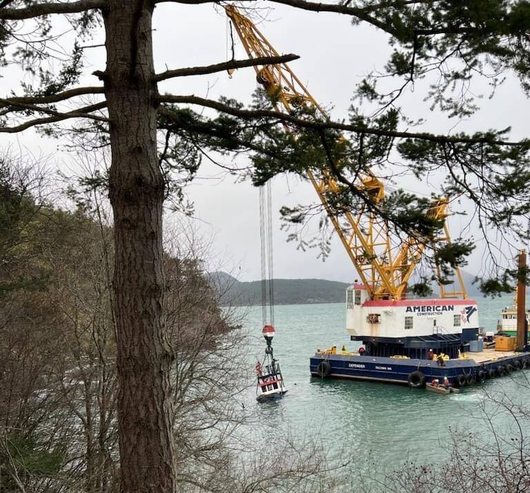 Contributed photo
The partially submerged Tugboat Tulalip is suspended near the Lopez ferry terminal in preparation for removal.