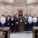 Contributed photo by Friends of the San Juans
Friday Harbor High School Eco Club students stand with 40th District Representative, Alex Ramel on the House Floor.
