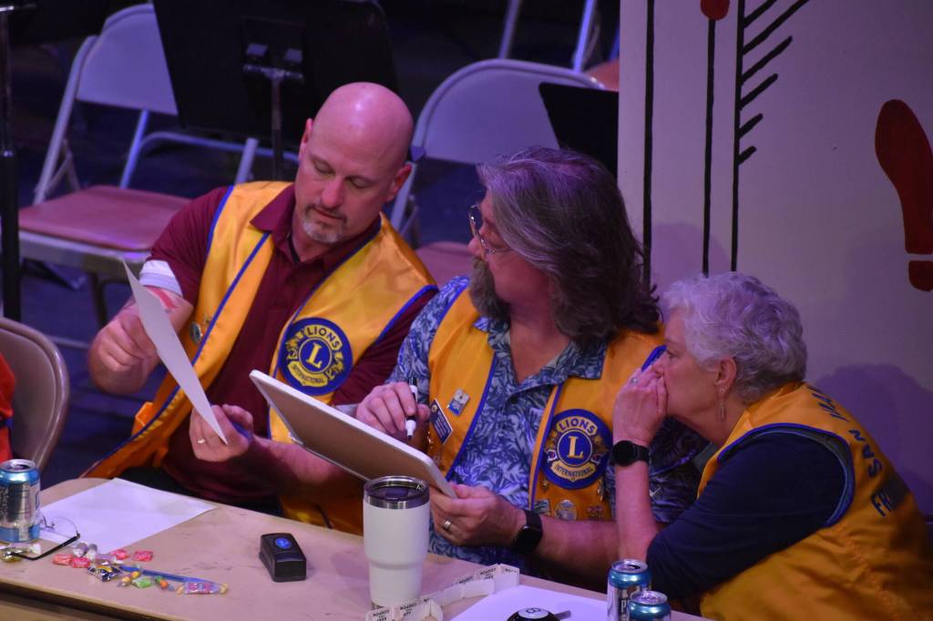 Kelley Balcomb-Bartok \ Staff photo
Lions Club members discuss a possible answer to a two-part question during the San Juan Public Schools Foundations 28th annual Knowledge Bowl.
