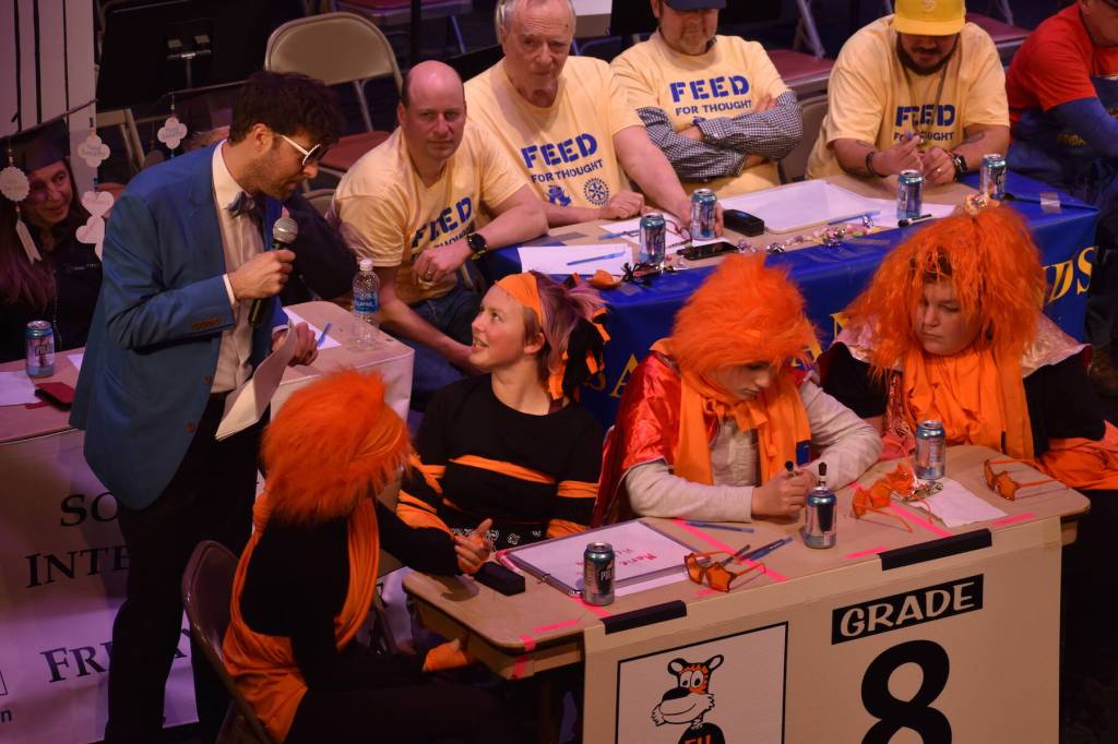 Kelley Balcomb-Bartok \ Staff photo
MC Mason Turnage listens to Liv Eisenhardt give her reasoning behind her teams answer during the San Juan Public Schools Foundations 28th annual Knowledge Bowl.