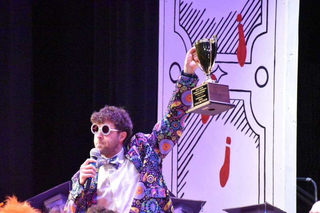 Kelley Balcomb-Bartok \ Staff photo
MC Mason Turnage raises the Goblet of Knowledge (aka Knowledge Bowl Cup) to present to the winning team during the San Juan Public Schools Foundations 28th annual Knowledge Bowl.