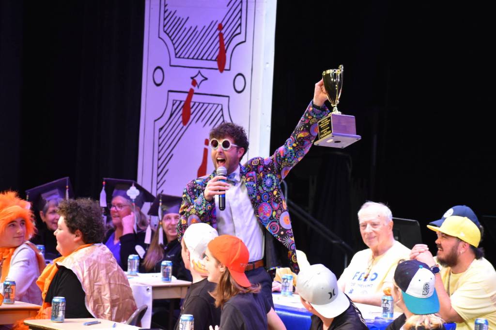 Kelley Balcomb-Bartok \ Staff photo
MC Mason Turnage presents the Goblet of Knowledge to the Friday Harbor Rotary team who won the San Juan Public Schools Foundations 28th annual Knowledge Bowl, beating the second-place Lions Club by two points.